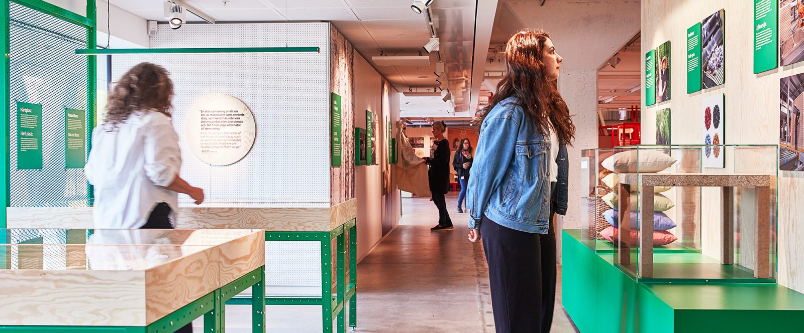 Two women at IKEA Museum exploring the Democratic Design exhibition.