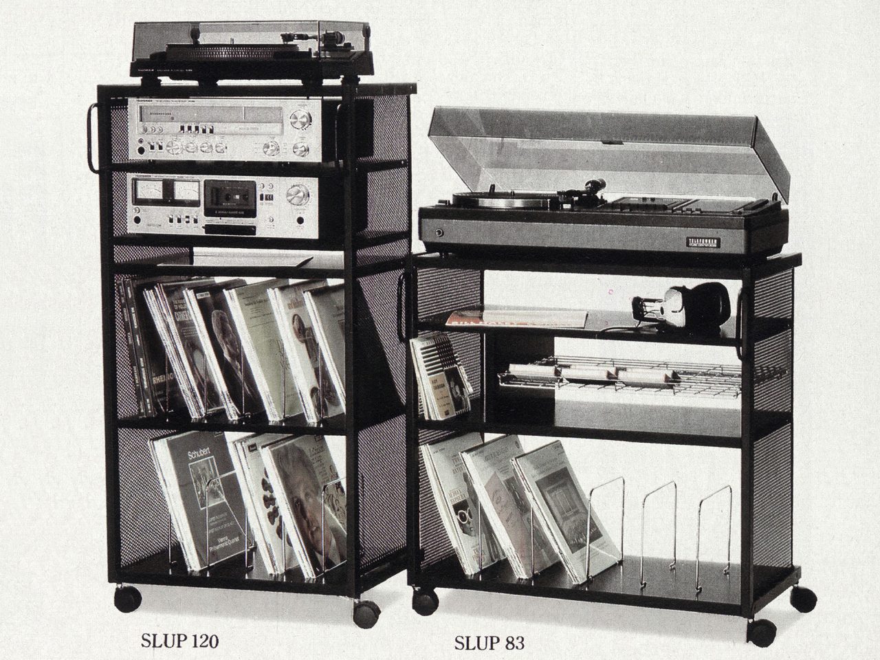 Tall music cabinet, SLUP, in black wood with LP records, music books, record player, amplifier, and cassette player.