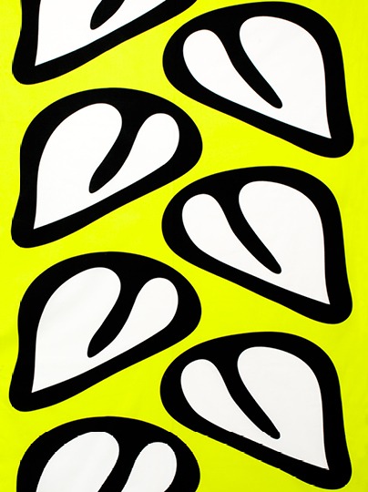 Yellow fabric with a bold black and white pattern.