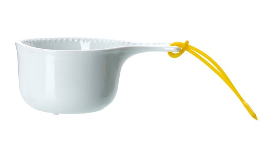 Simple white porcelain cup with yellow string.