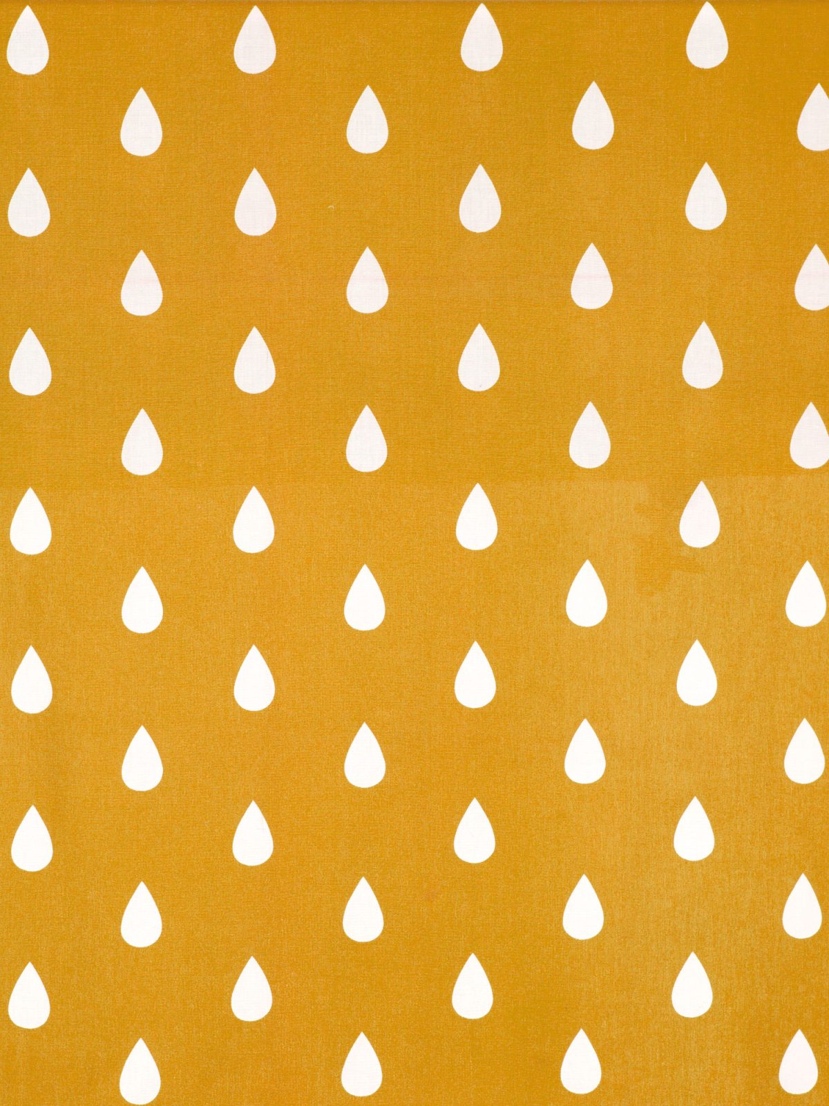 Mönster med vita droppar på gul bakgrund.