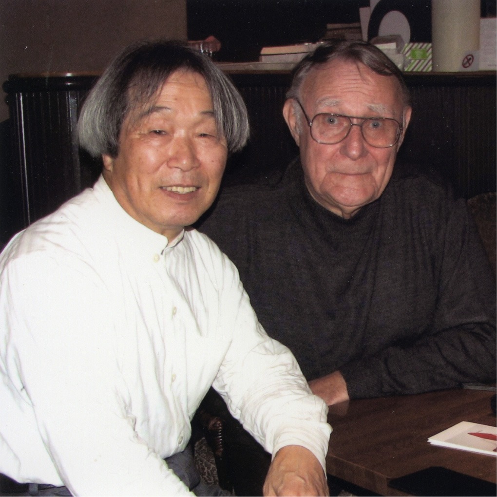 Two smiling older men, Noboru Nakamura and Ingvar Kamprad, sit next to each other.