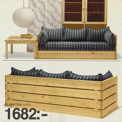 1970s style pine sofa with blue cushions.