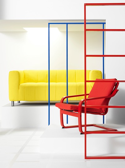 Red armchair and yellow sofa with puffy cover.
