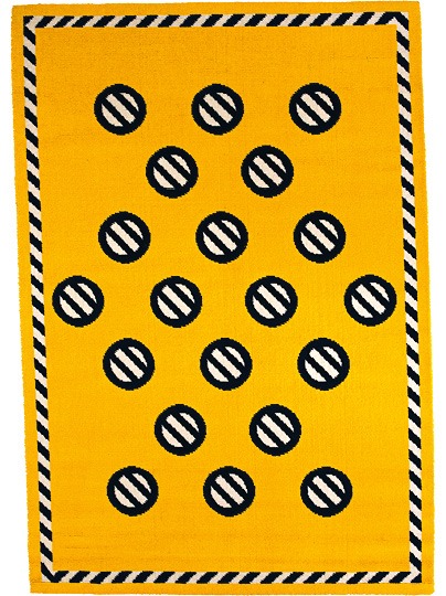 Yellow rug with black and white striped border and big round dots with black and white stripes and black border, GIFTIG.