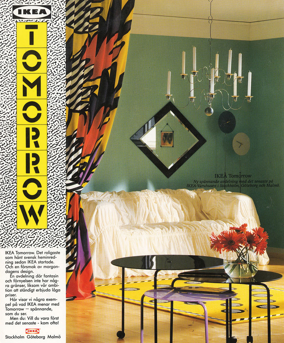 Living room with white sofa, silver candelabra with candles, 1980s style round side tables and a colourful drape.