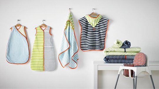 Baby sleeping bag and accessories, many with stripes, hung up and laid out, PYTTELILLA.