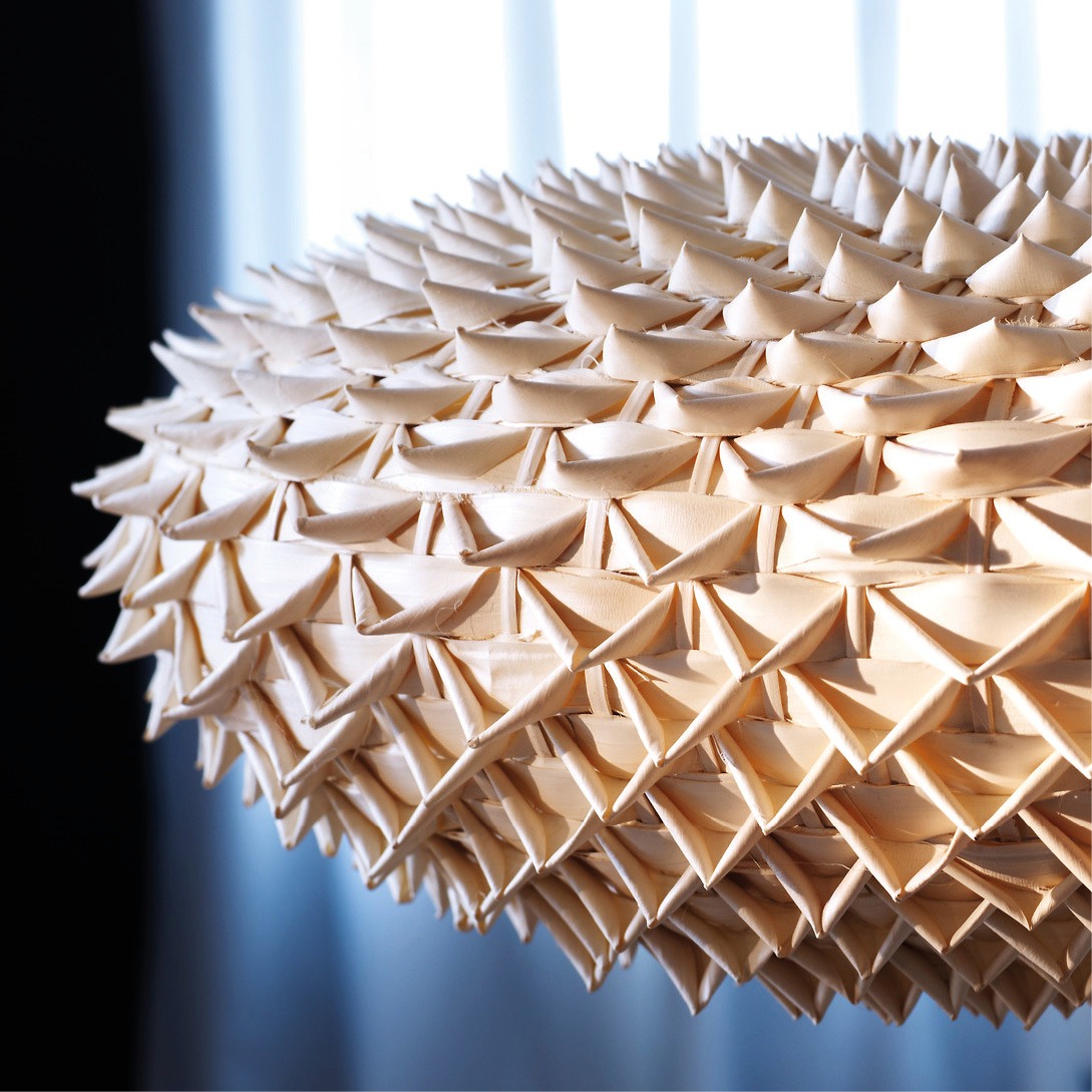Close-up of spiky, discus-shaped woven pendant lamp, IKEA PS VÄVA.