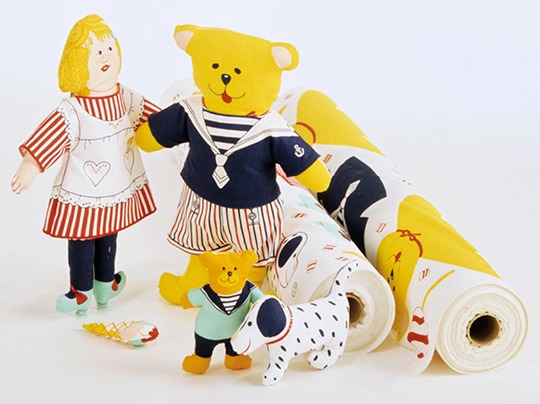 Group of soft toys, including a girl doll, a teddy bear, and two fabric bales, KONRAD.