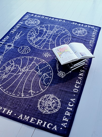 Dark blue rug with stylised design inspired by old world maps, ORTEN.