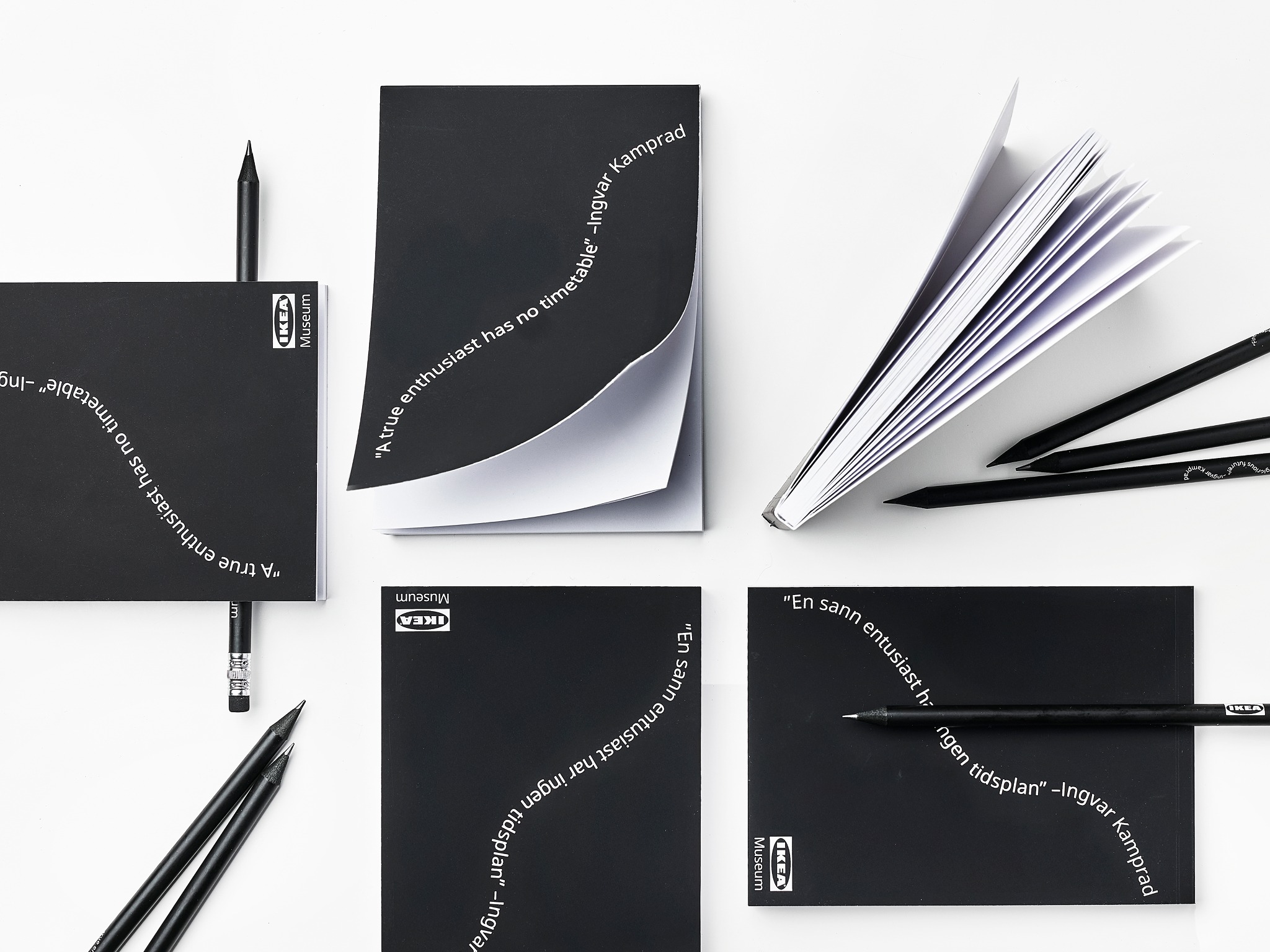 Several black notebooks that open from the top.